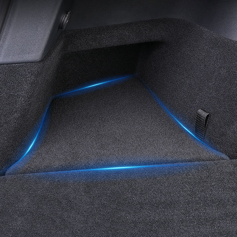 Car trunk space with blue ambient LED lighting along the floor edges.