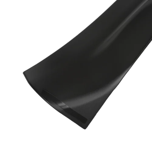 Close-up of a matte black curved automotive spoiler blade for a car.