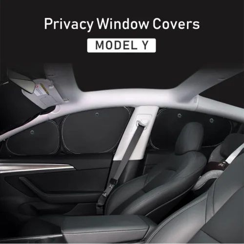 Interior of a Tesla Model Y with privacy window covers on the rear side windows.