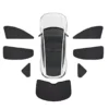 Top-down view of a white car surrounded by a full set of black window shades laid out around it, illustrating a complete sun shade kit.