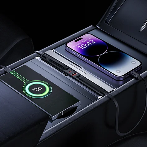 In-car wireless charging area with two devices: a smartphone resting on a charging pad and a second device showing a green 90% battery ring, all mounted in the console.