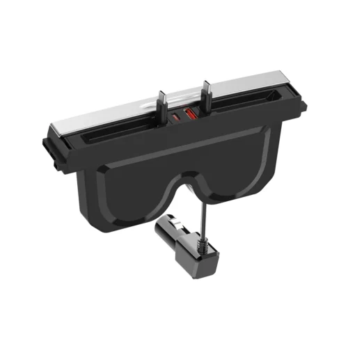 Black virtual reality headset with a silver top and a small clamp attachment extending from a rod