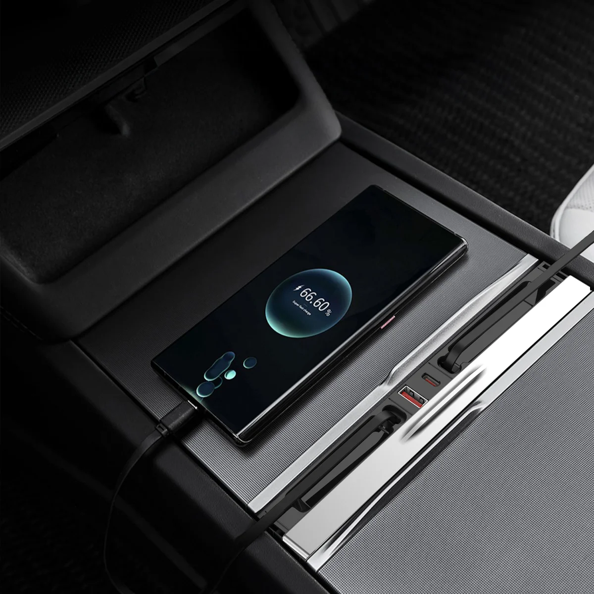 Phone resting in a car's center console charging dock, screen showing 66% battery remaining (charging in progress).