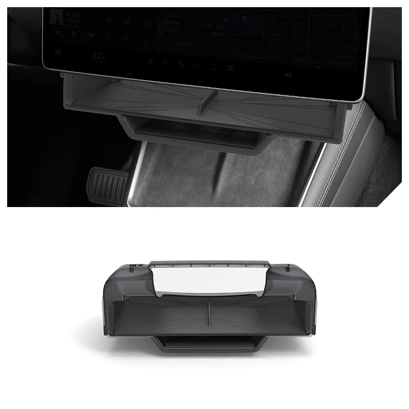 Fold-out center console tray in a car, shown under a mounted tablet for storage.