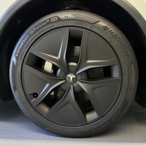 Tesla alloy wheel with a matte black turbine-style rim and a Hankook Ventus S1 evo3 tire