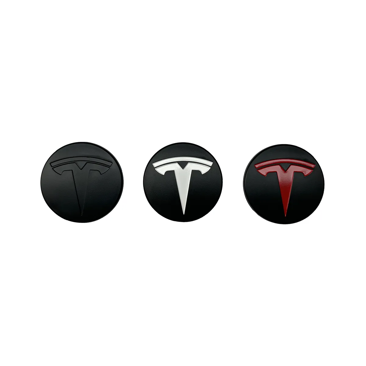Three circular Tesla logos on black discs: dark gray left, white center, red right
