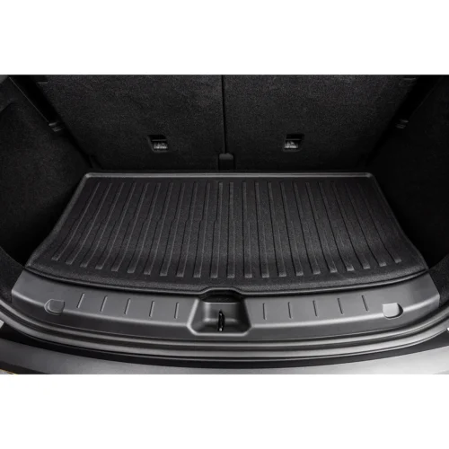 Open car trunk showing a black textured rubber cargo mat covering the floor of the cargo area.